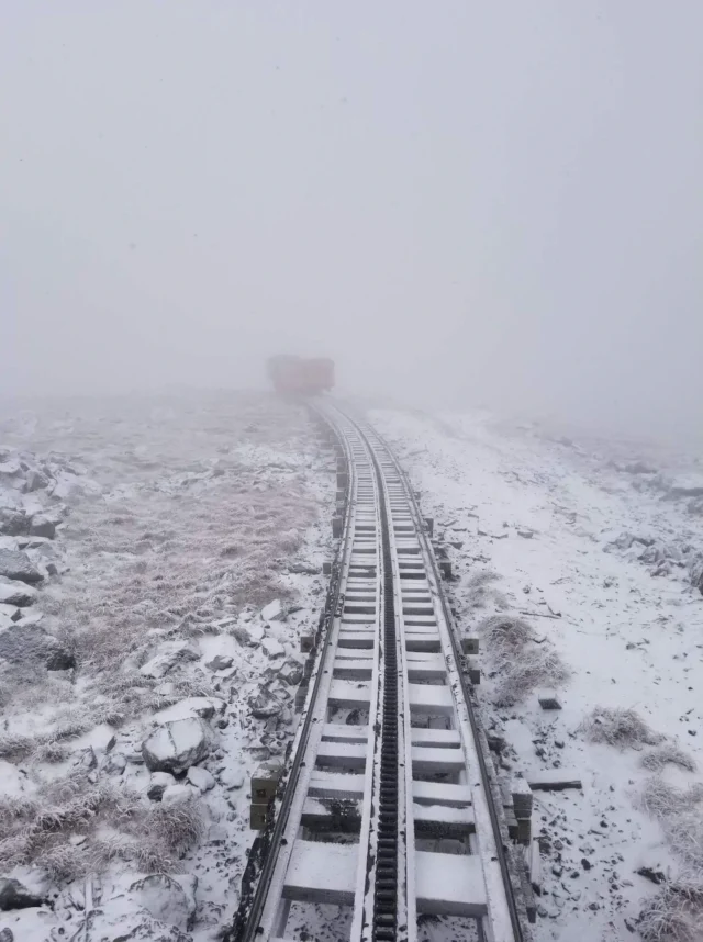 Train tracks fog snow